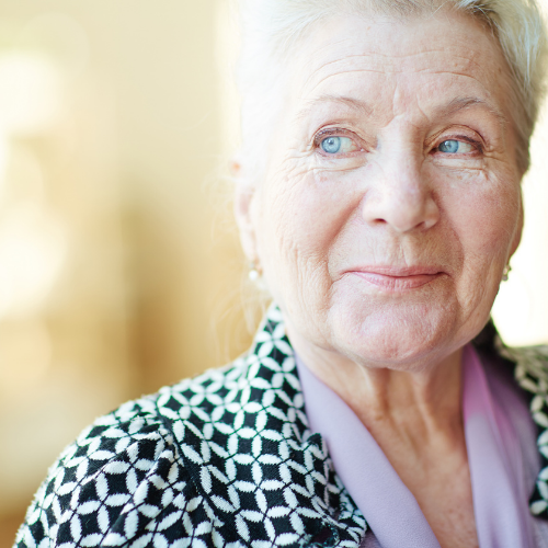 Elderly retired woman smiling.