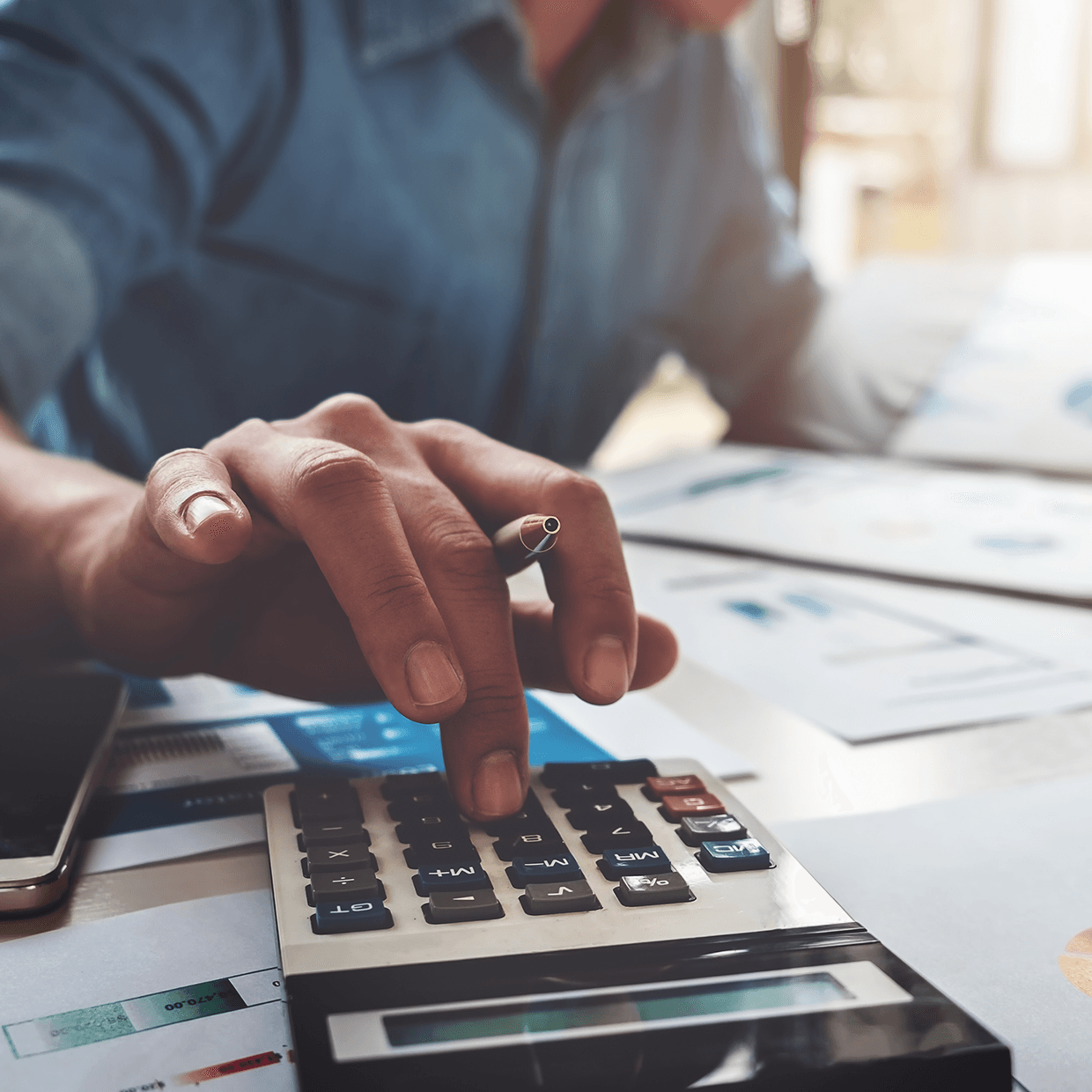 Man using a calculator.