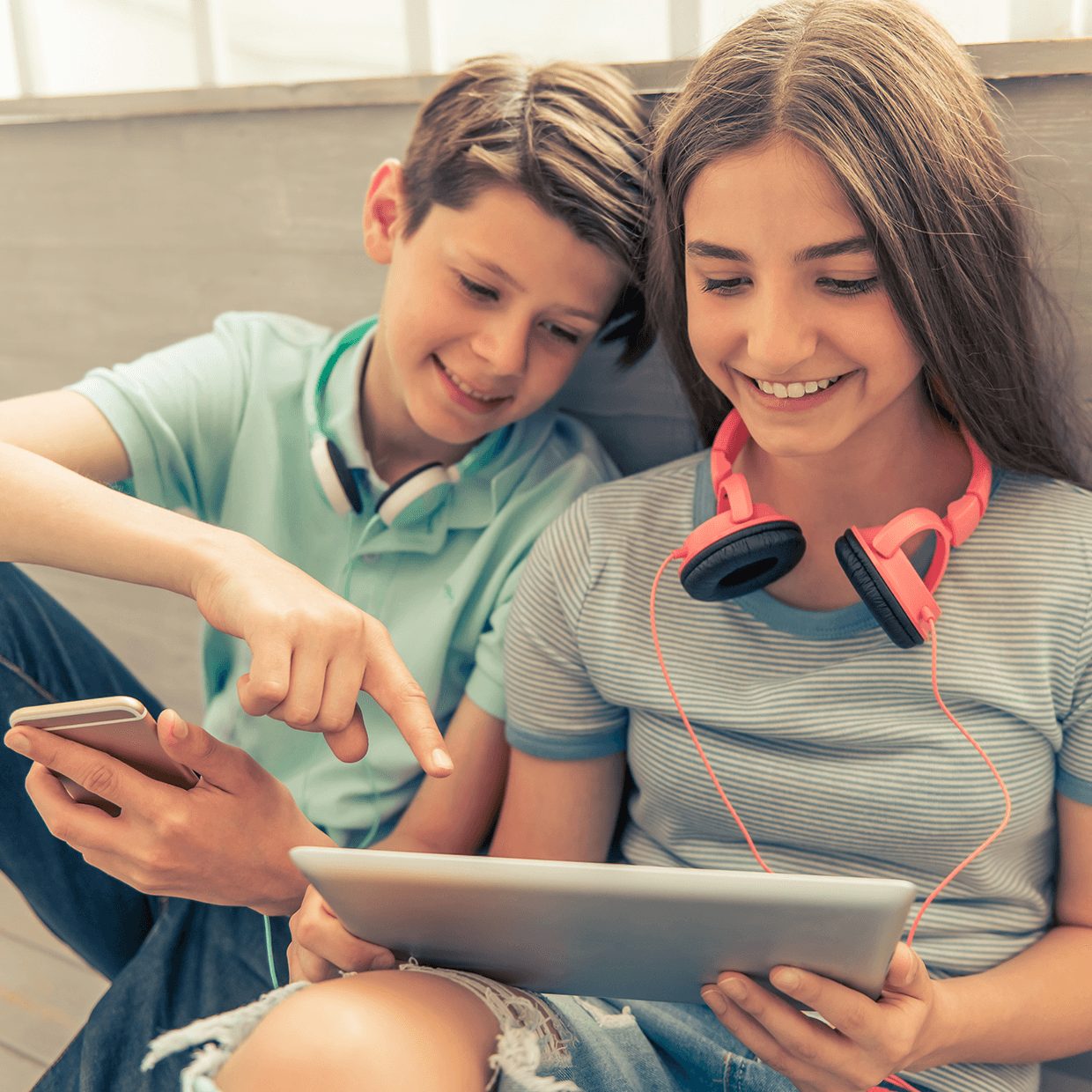 Youth playing on a laptop.